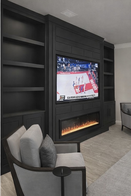Black built-in media wall with floating side shelves