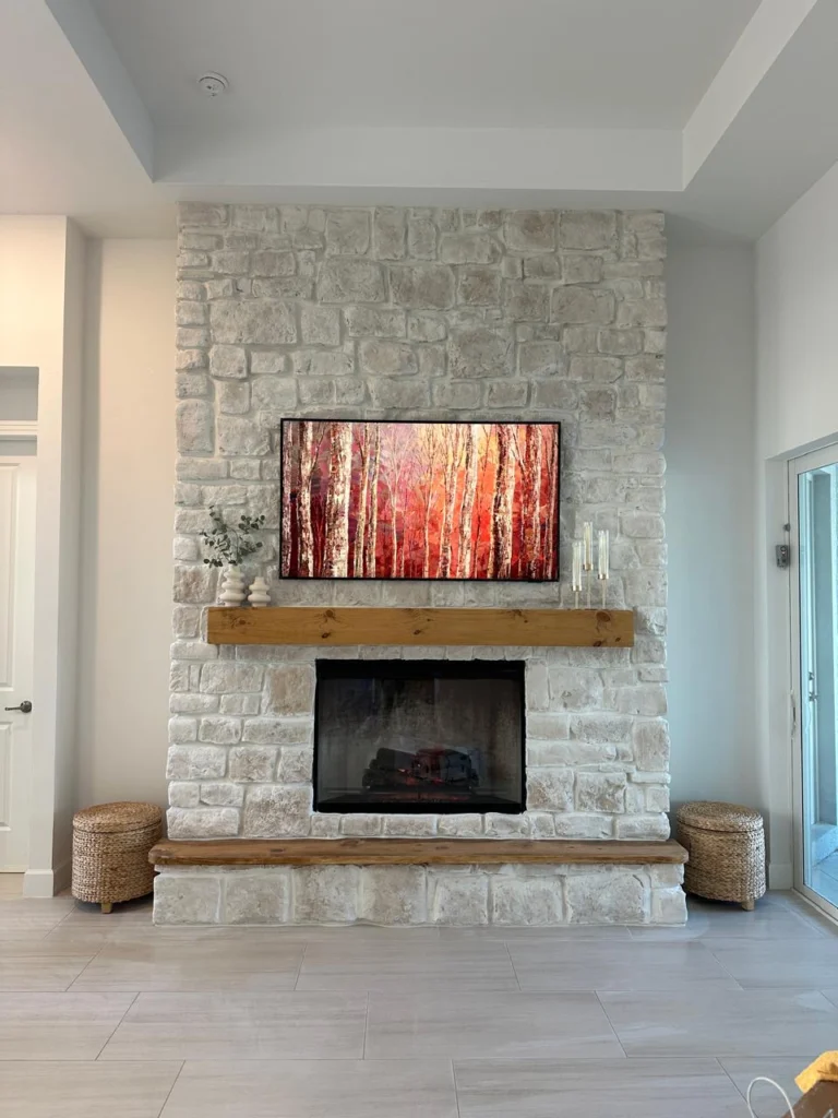 Limestone fireplace wall with illuminated built-ins for a Fort Myers living room