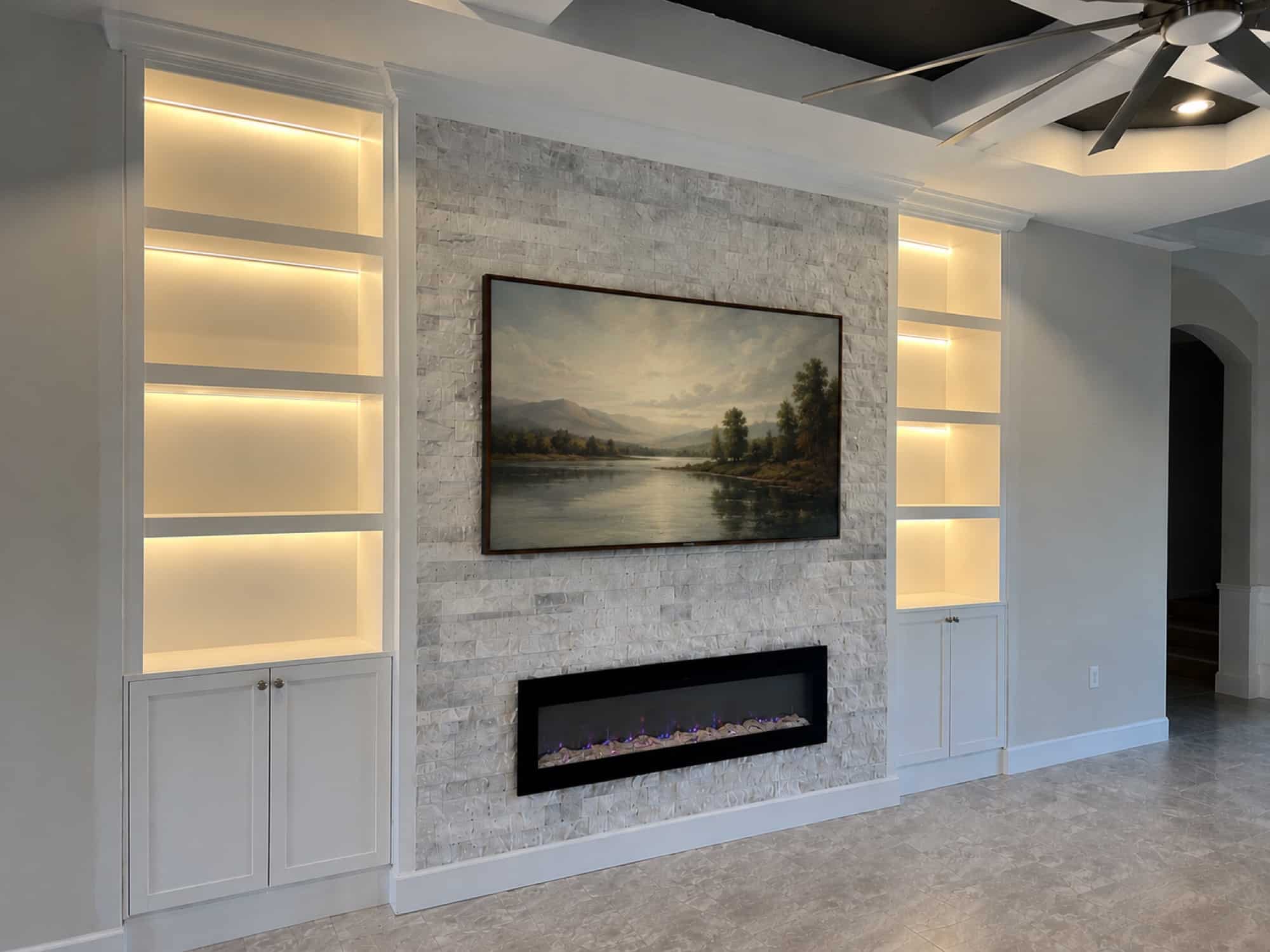 Melbourne FL textured white media wall Textured white fireplace media wall with illuminated shelving in Melbourne Florida