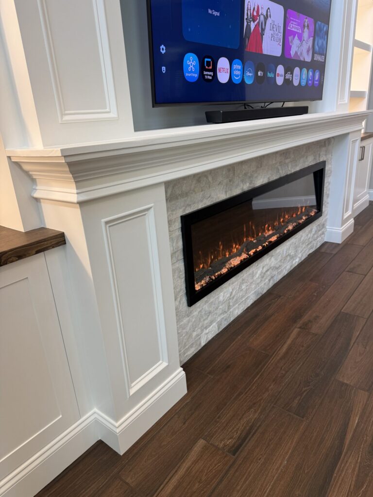 Custom mantel and light stone fireplace surround detail